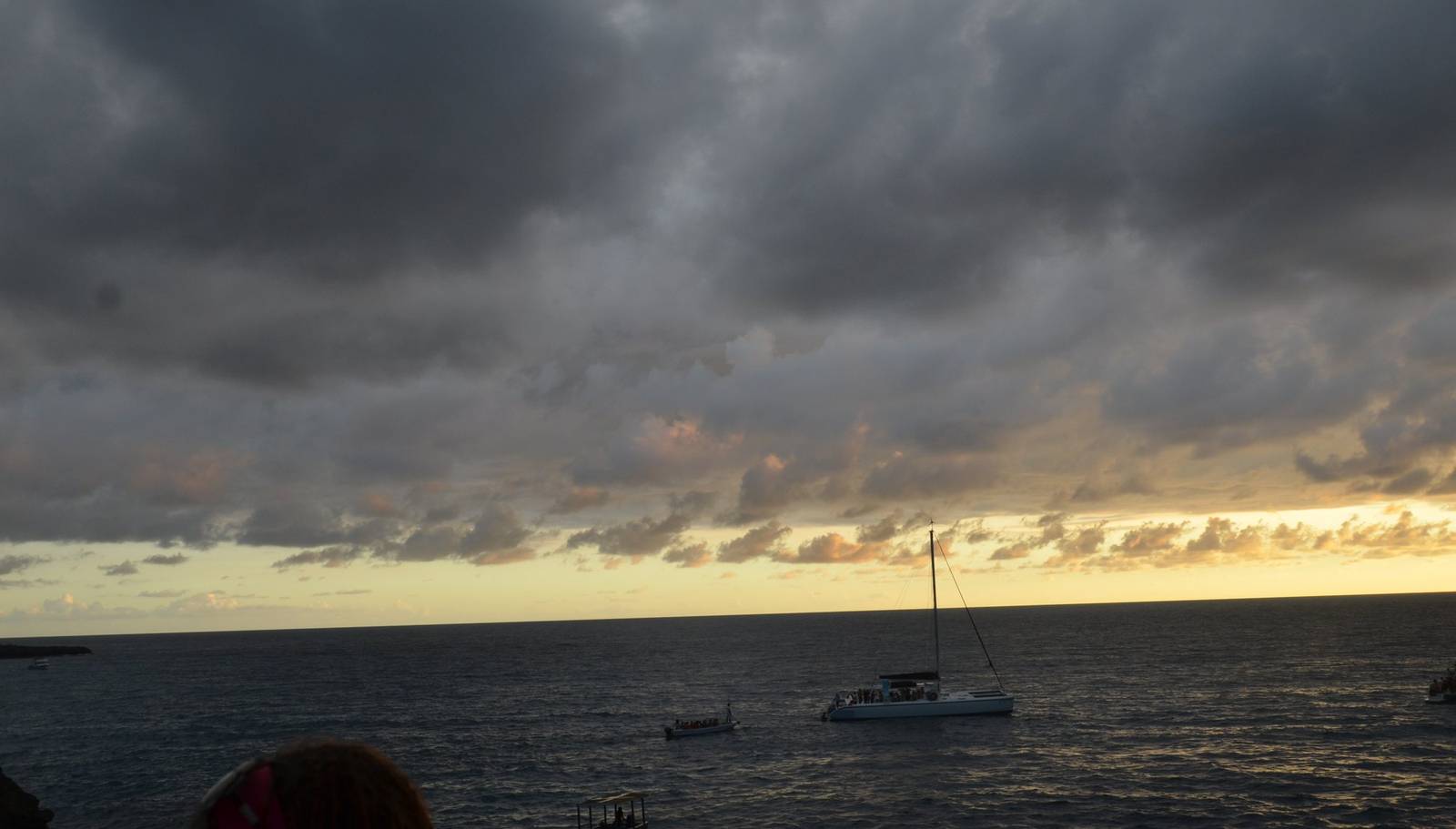 A storm passing over the sea at sunset