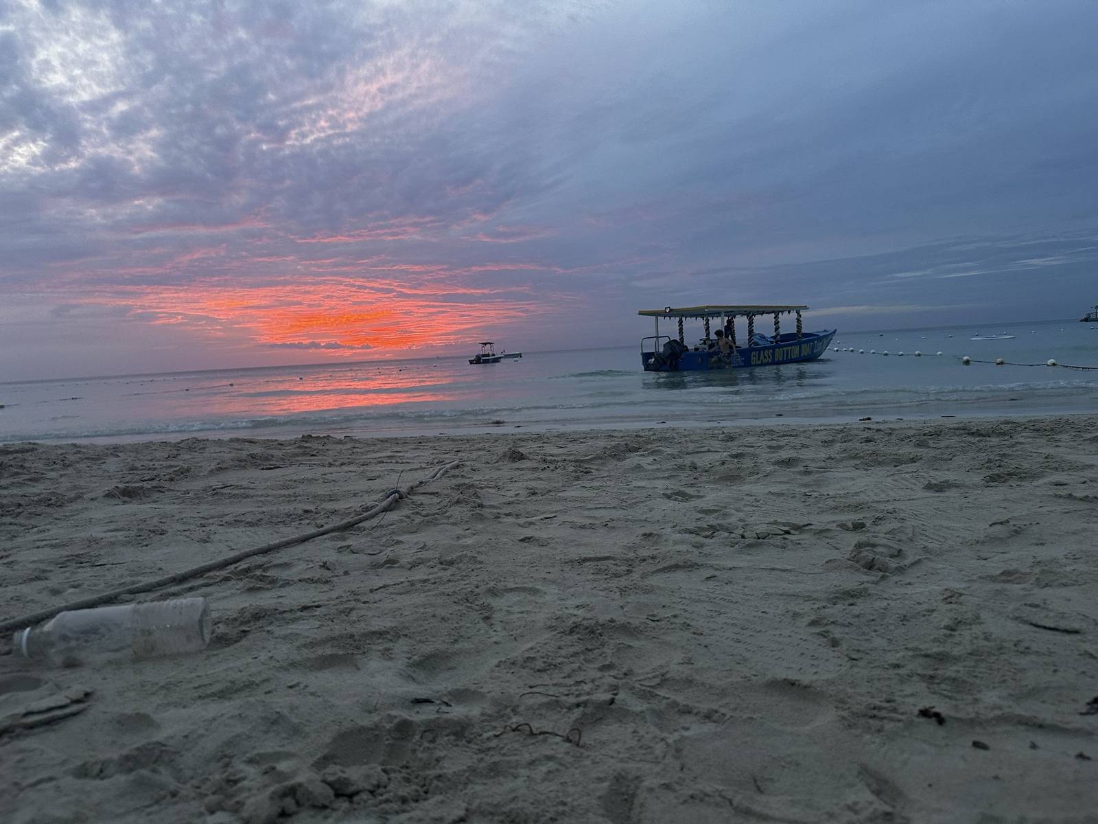 A blazing red sunset over the sea in Jamaica