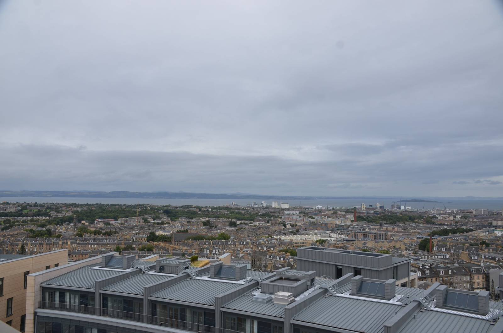Edinburgh rooftops stretching to the sea